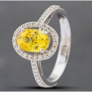 Pre-Owned 18ct White Gold Oval Cut Yellow Sapphire & Brilliant Cut Diamond Halo Ring 43361094